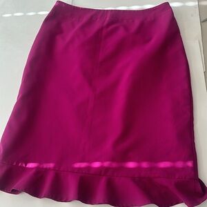 Magenta pink women’s size 12 skirt with bottom ruffle.